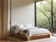 Modern minimalist bedroom design with neutral tones.