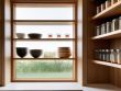 Modern organized pantry design with clear containers.